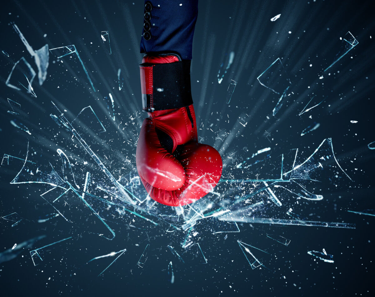 6 Ways to Boost the Pain Punching Power of Battle Balm article. Image of fist pounding glass and it shattering.